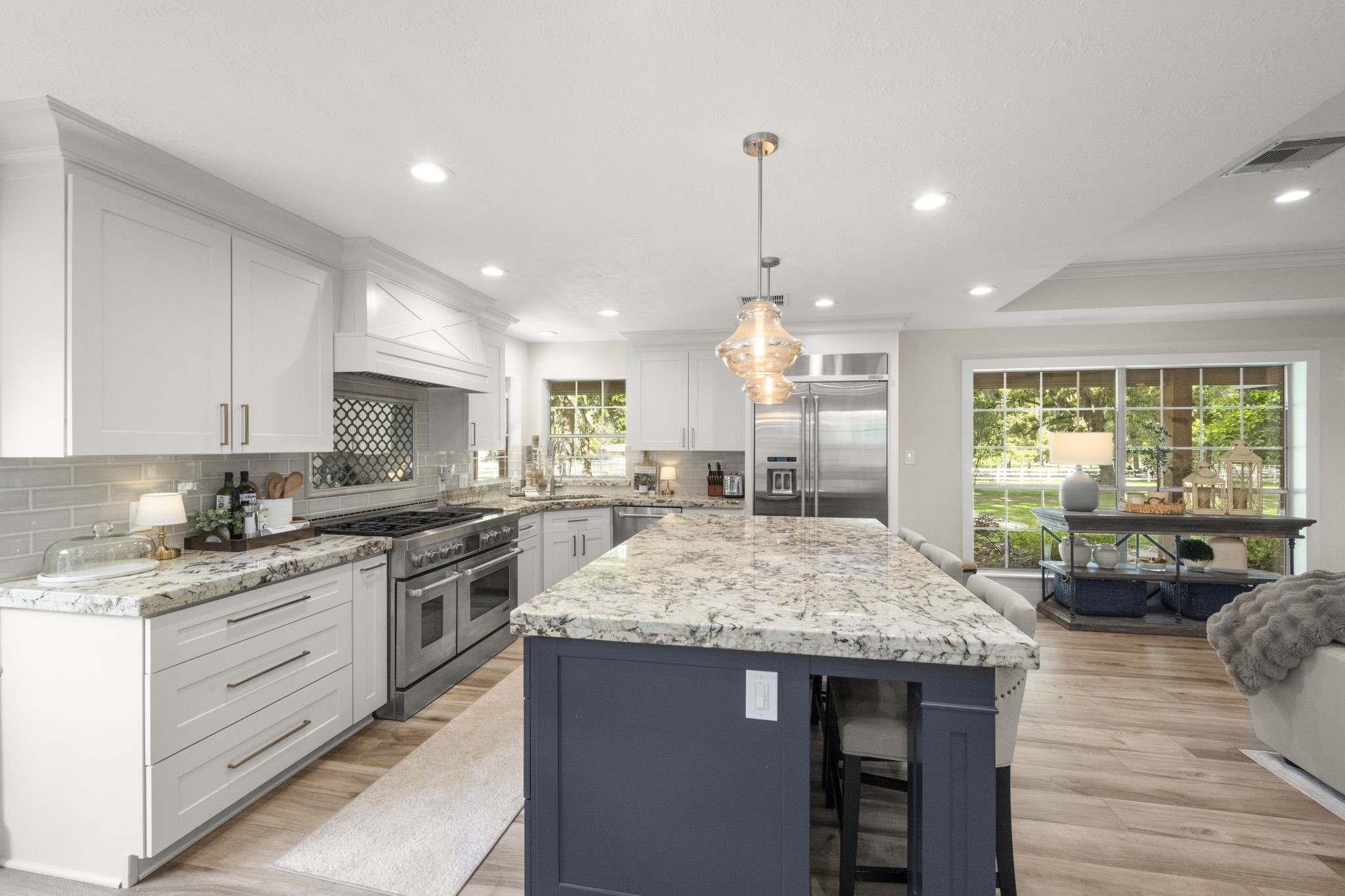 8555 Matthews Lane Magnolia, TX 77354 - Photo 11 of 37 a kitchen with stainless steel appliances granite countertop stove top oven and cabinets