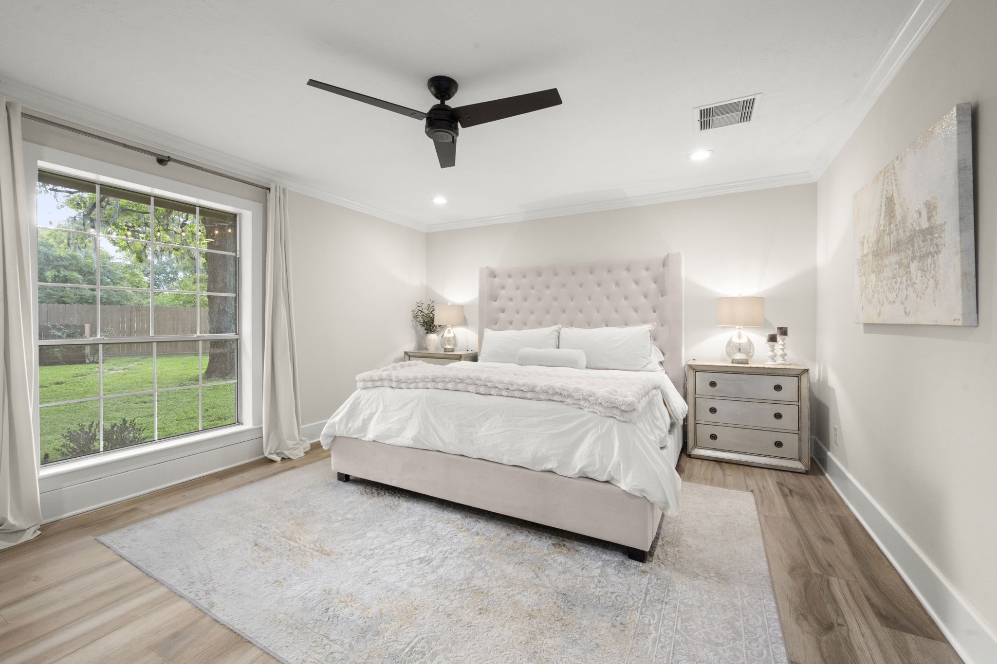 8555 Matthews Lane Magnolia, TX 77354 - Photo 17 of 37 a bedroom with a large bed and a window