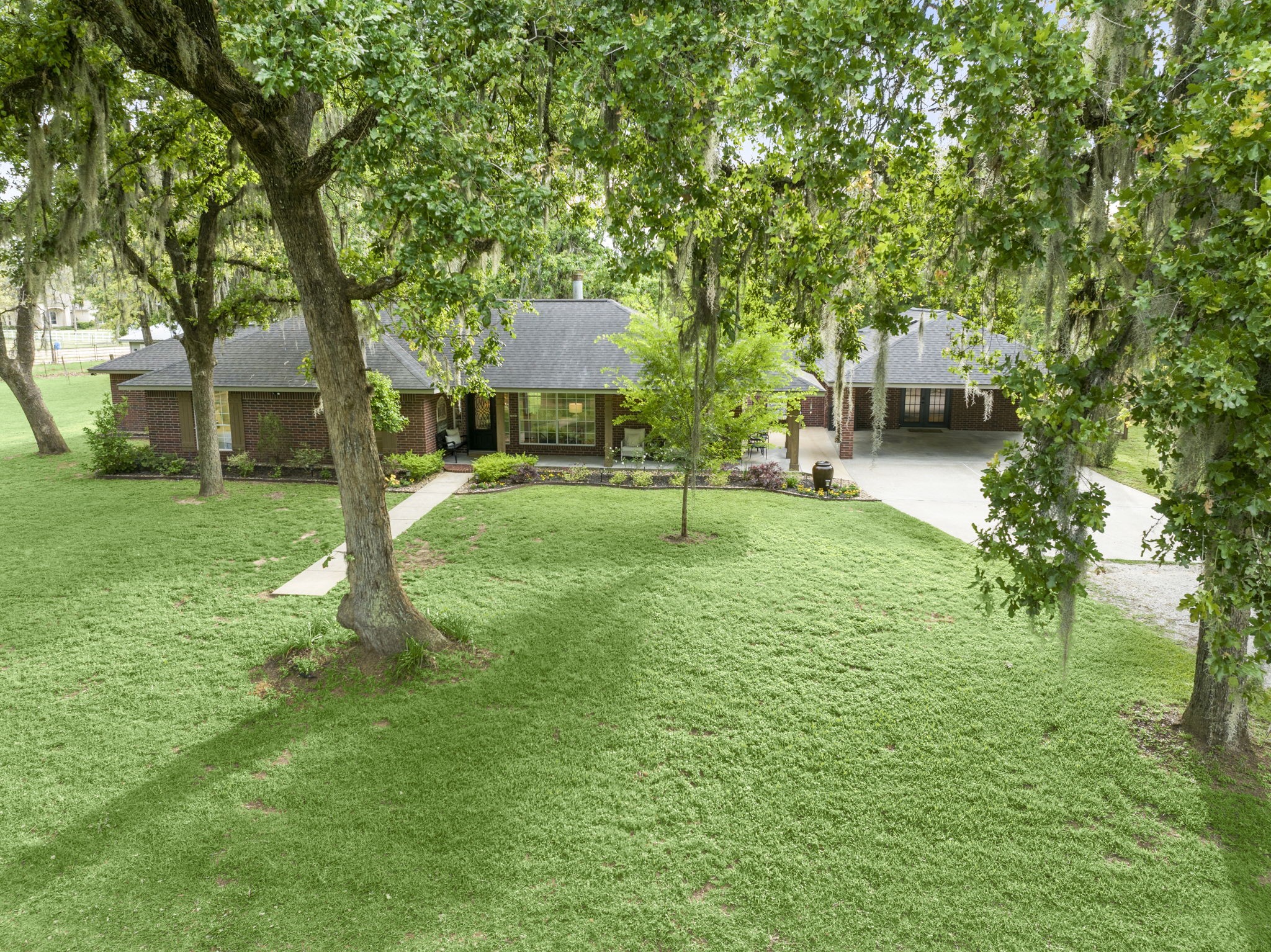 8555 Matthews Lane Magnolia, TX 77354 - Photo 3 of 37 a backyard of a house with table and chairs