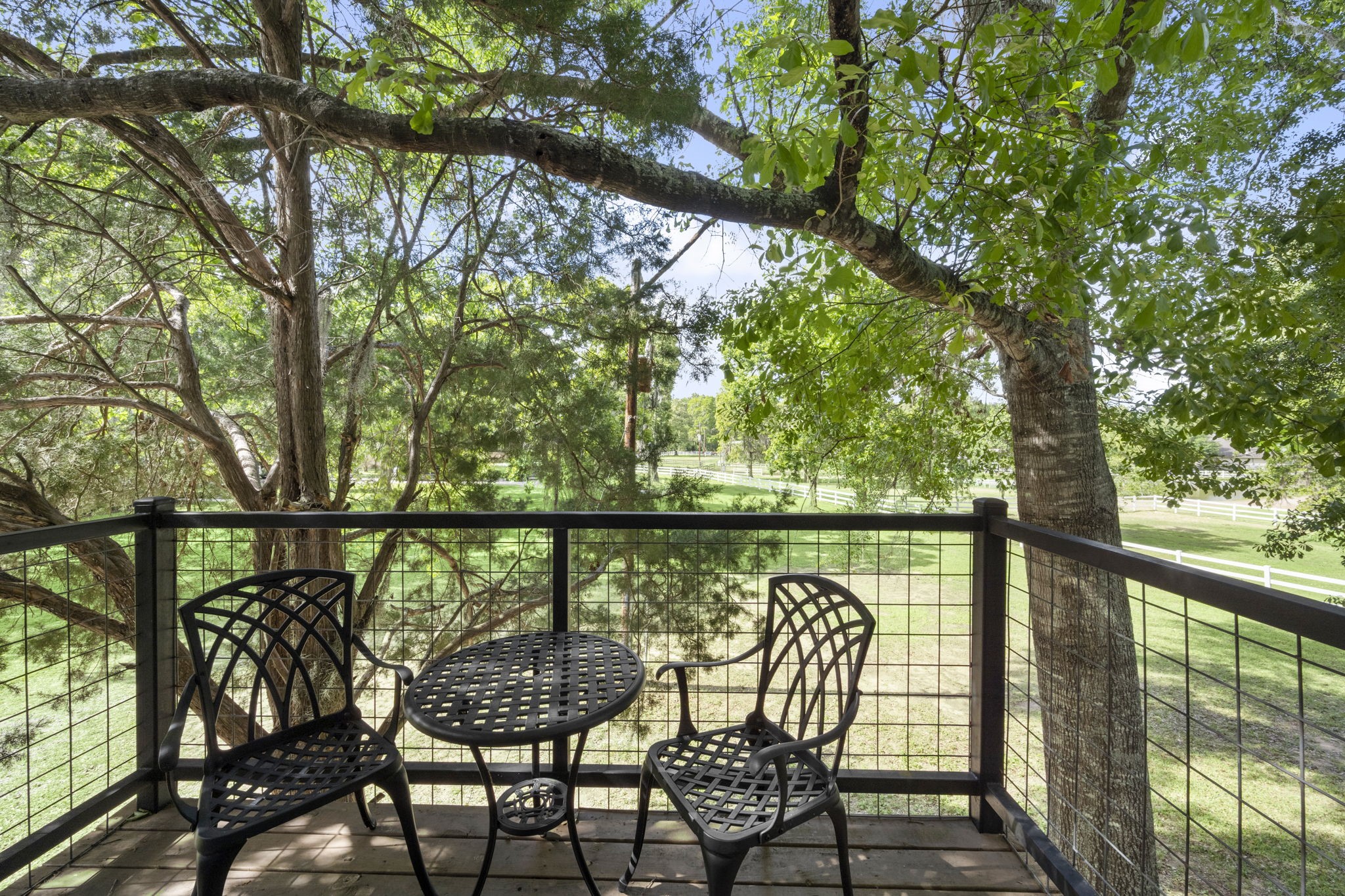 8555 Matthews Lane Magnolia, TX 77354 - Photo 34 of 37 a view of a balcony with an outdoor seating