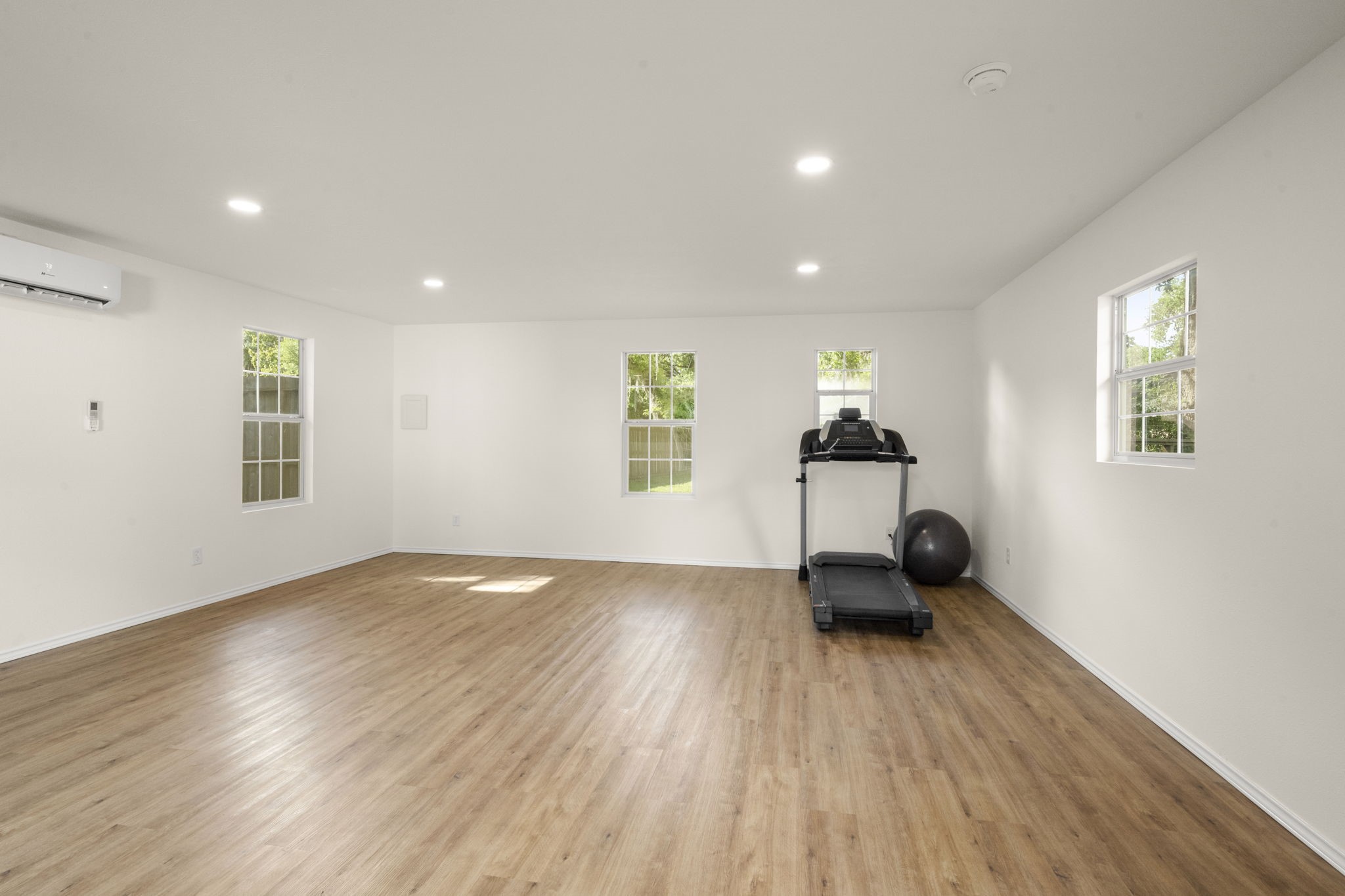 8555 Matthews Lane Magnolia, TX 77354 - Photo 36 of 37 a view of empty room with wooden floor and fan