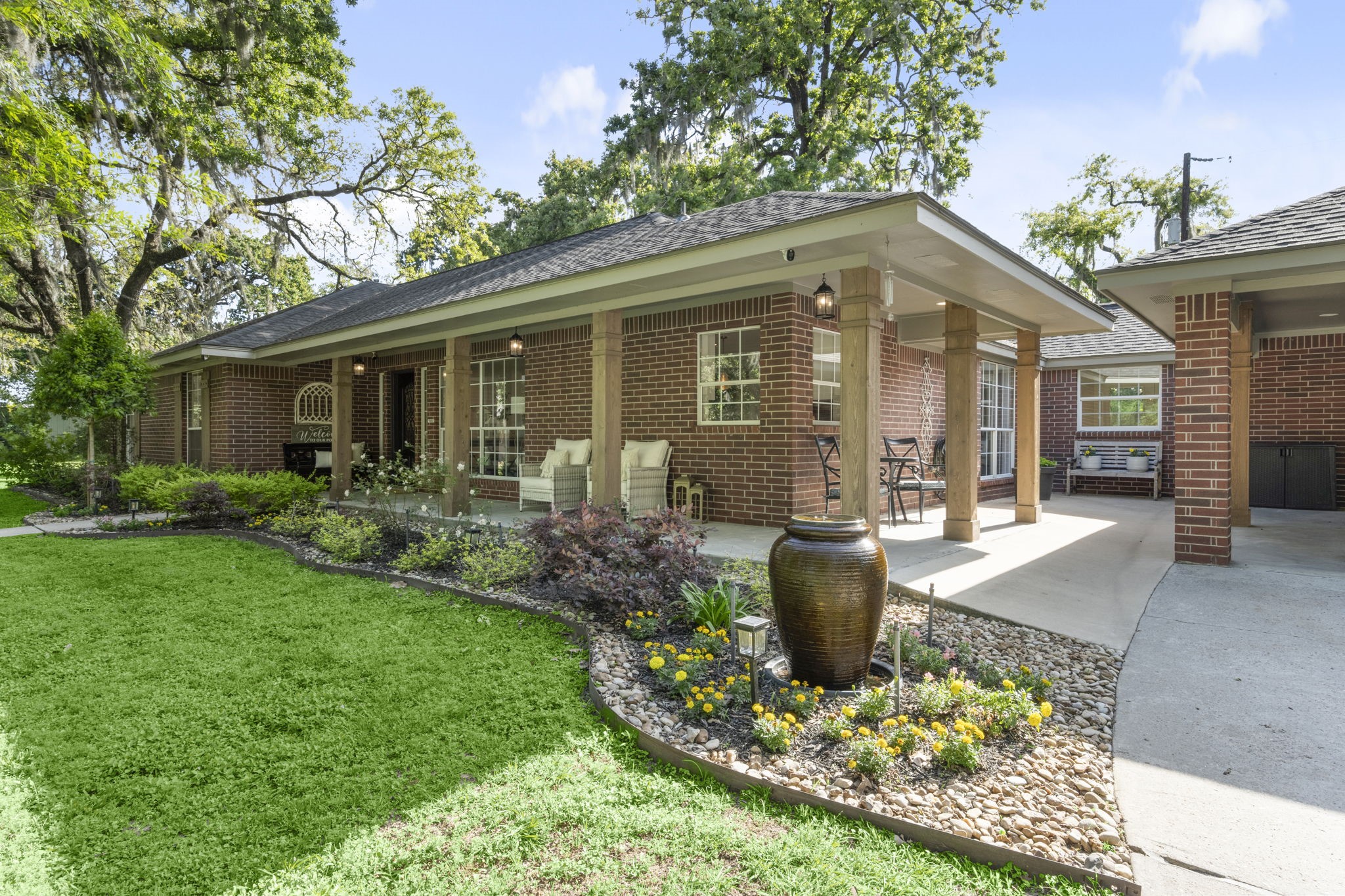 8555 Matthews Lane Magnolia, TX 77354 - Photo 4 of 37 a front view of a house with garden and porch