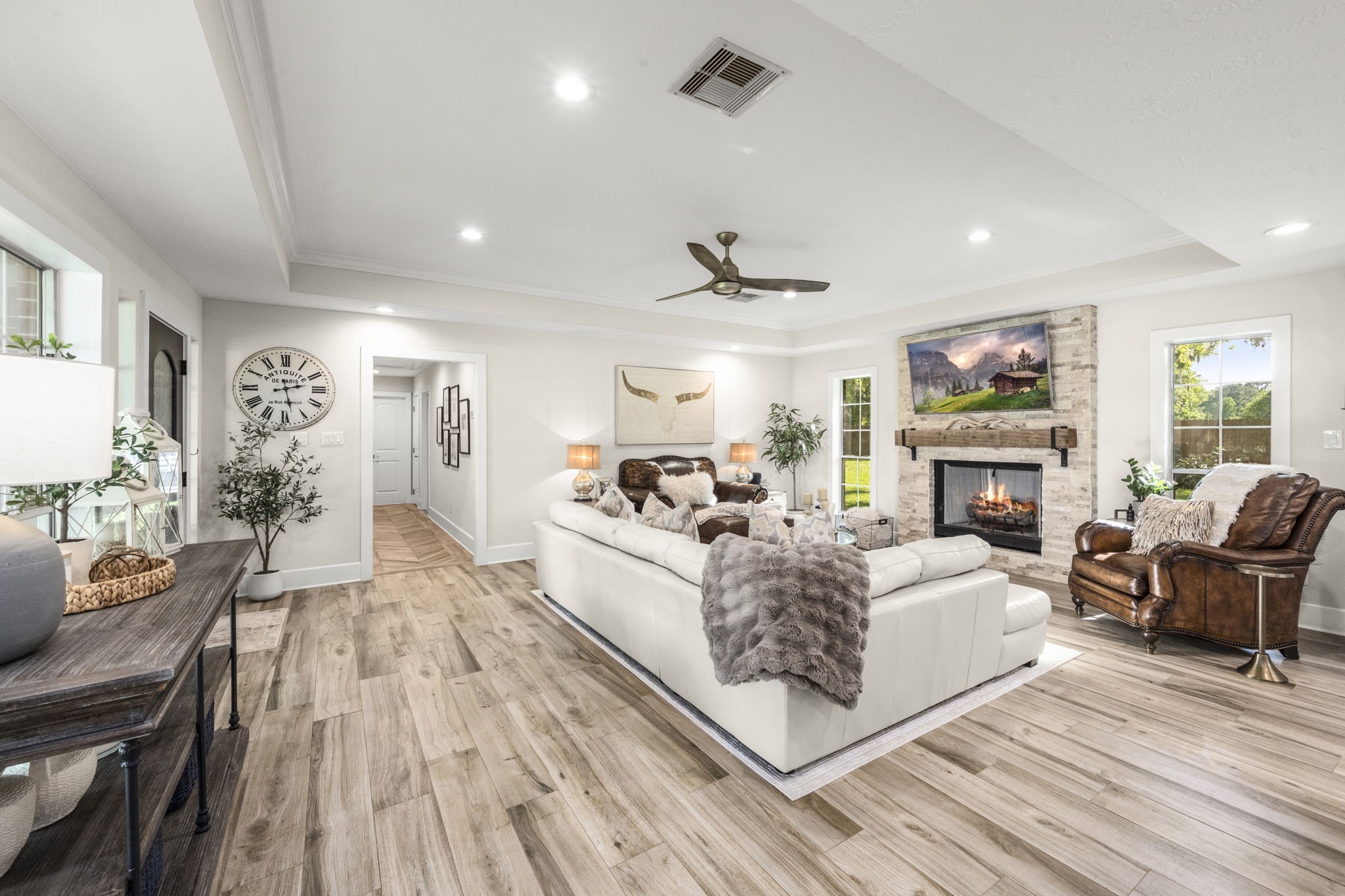 8555 Matthews Lane Magnolia, TX 77354 - Photo 9 of 37 a living room with furniture a fireplace and a flat screen tv