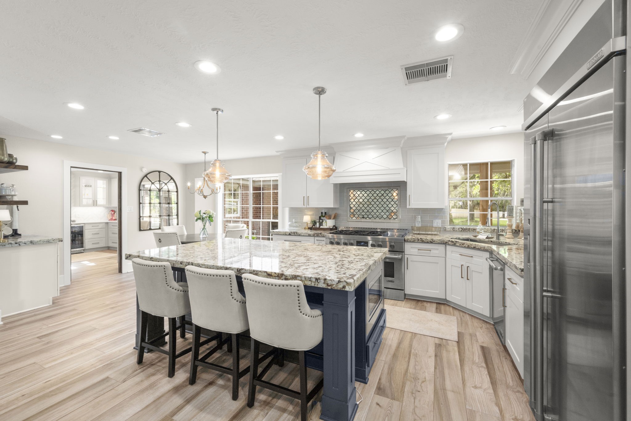 8555 Matthews Lane Magnolia, TX 77354 - Photo 10 of 37 a large kitchen with a table and chairs