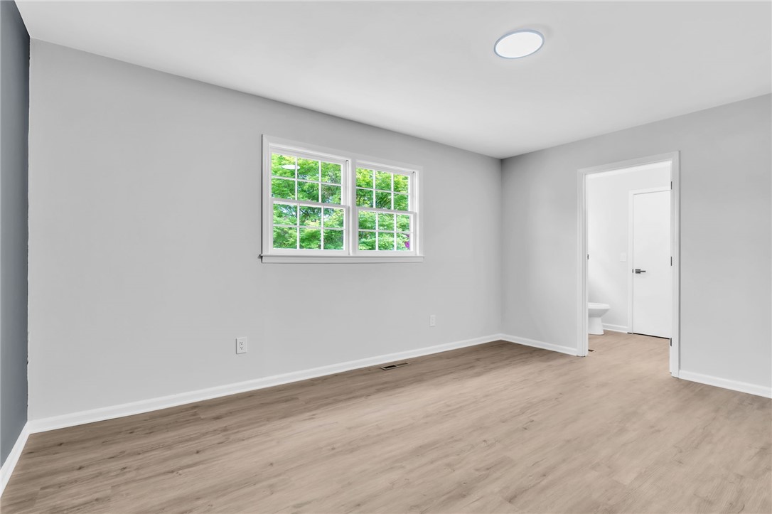 403 Keith Lane Seneca, SC 29678 - Photo 12 of 28 This airy room offers light wood-look flooring and a view of the outdoors.