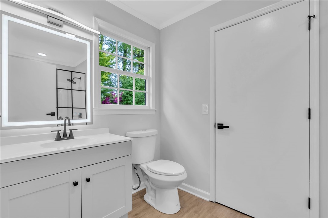 403 Keith Lane Seneca, SC 29678 - Photo 14 of 28 This bright bathroom features a vanity, modern fixtures, and ample natural light.