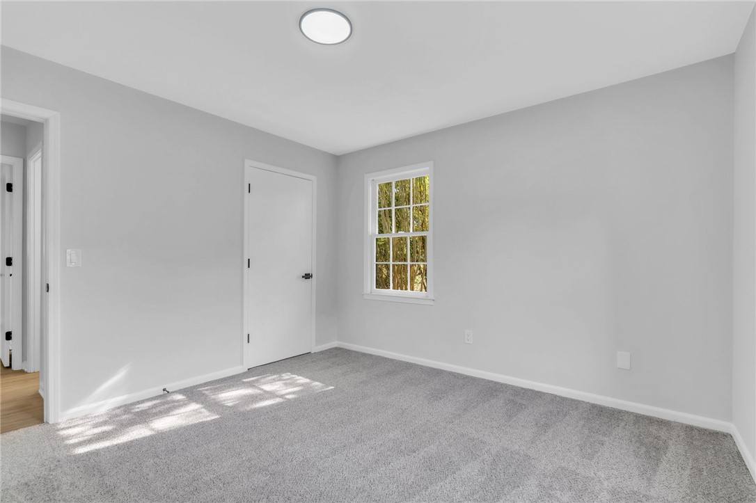 403 Keith Lane Seneca, SC 29678 - Photo 17 of 28 Bright and airy, this room features carpeted floors and a window offering natural light.