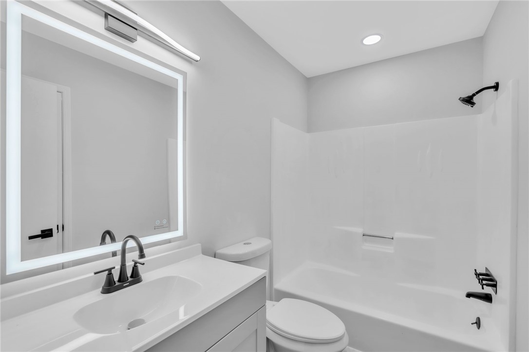 403 Keith Lane Seneca, SC 29678 - Photo 19 of 28 This modern bathroom features clean lines and essential fixtures, perfect for daily routines.