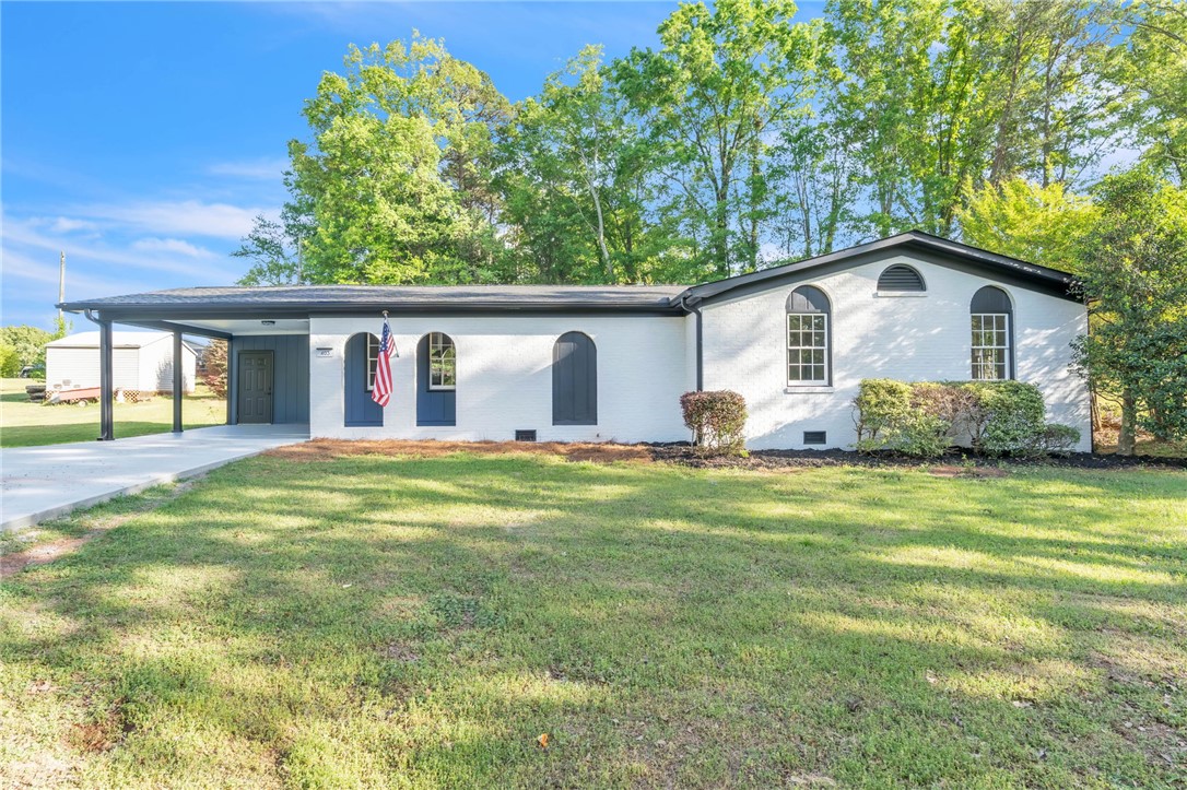 403 Keith Lane Seneca, SC 29678 - Photo 2 of 28 This charming residence features a well-maintained exterior, mature trees, and a convenient carport.