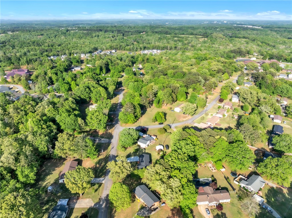 403 Keith Lane Seneca, SC 29678 - Photo 27 of 28 An aerial perspective reveals a vibrant neighborhood with abundant greenery and winding roads.