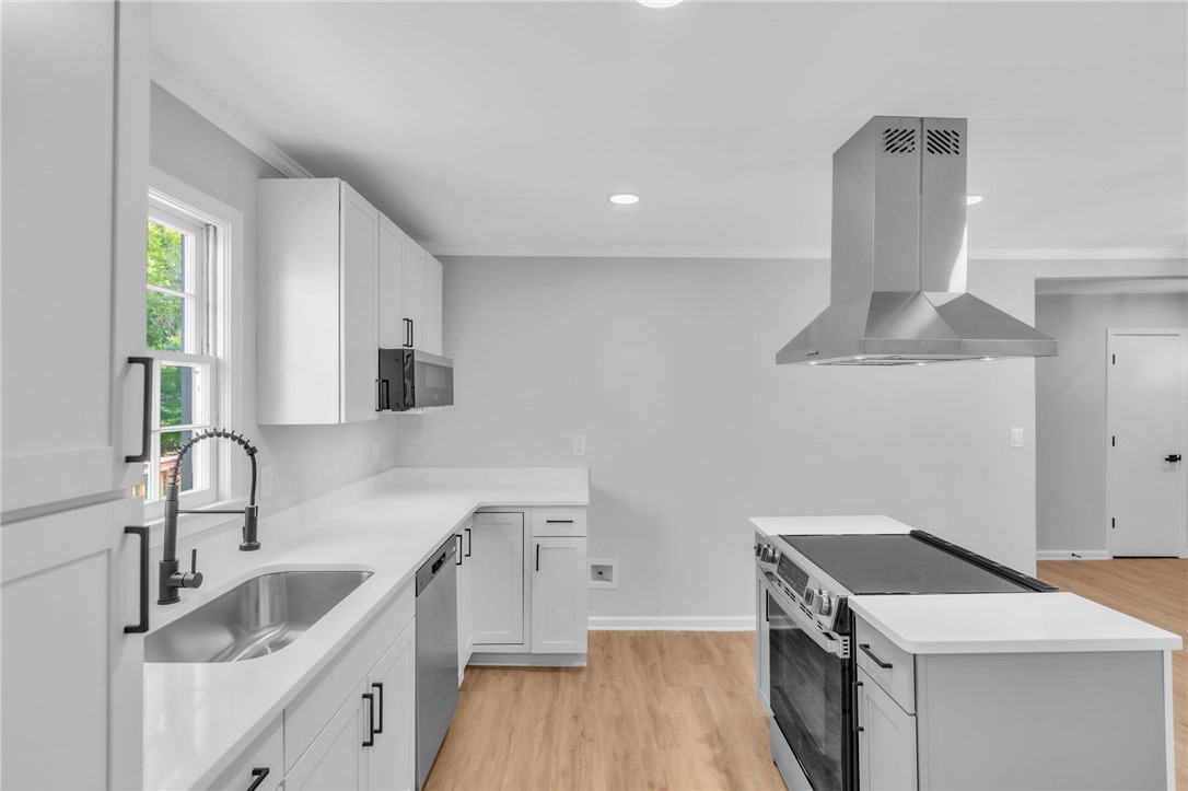 403 Keith Lane Seneca, SC 29678 - Photo 6 of 28 Modern kitchen with sleek countertops and ample cabinetry, ready for culinary creations.