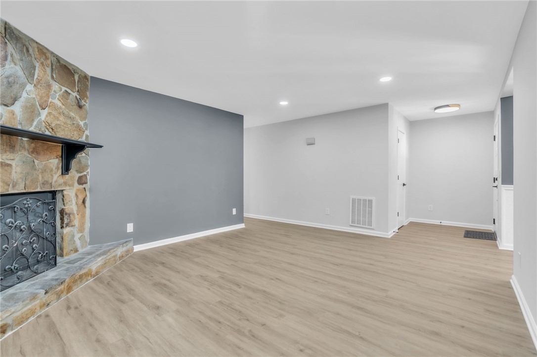 403 Keith Lane Seneca, SC 29678 - Photo 9 of 28 This expansive living area offers a cozy fireplace and versatile layout for comfortable living.