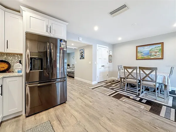 a living room with furniture a rug and a window