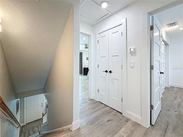 a bedroom with a bed and a ceiling fan