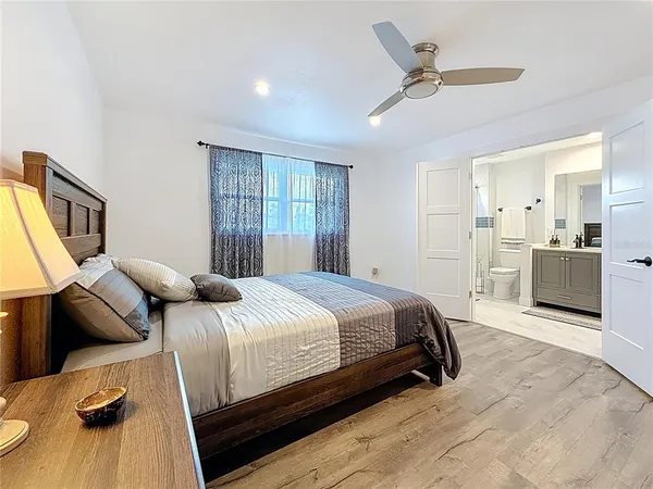a spacious bathroom with a double vanity sink a mirror and a shower
