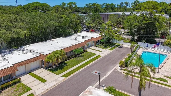 a living room with furniture and a ceiling fan