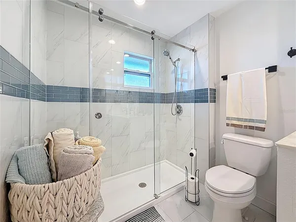 a view of a house with backyard and porch