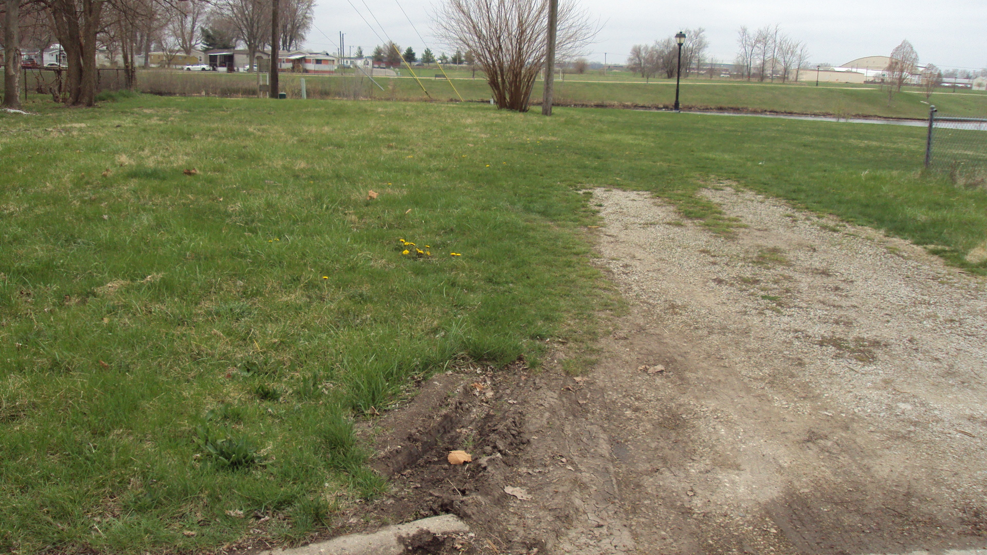 1100 East Champaign Avenue Rantoul, IL 61866 - Photo 2 of 2 a view of a field with large trees