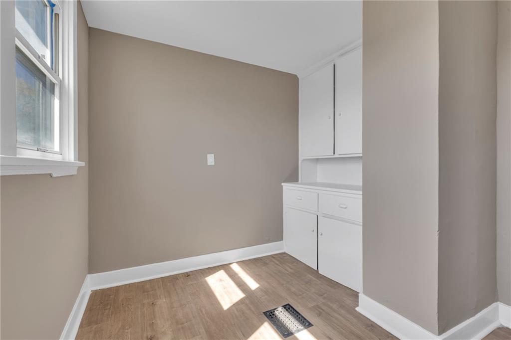 427 Jackson Street Rochester, PA 15074 - Photo 13 of 20 a view of an empty room with cabinet