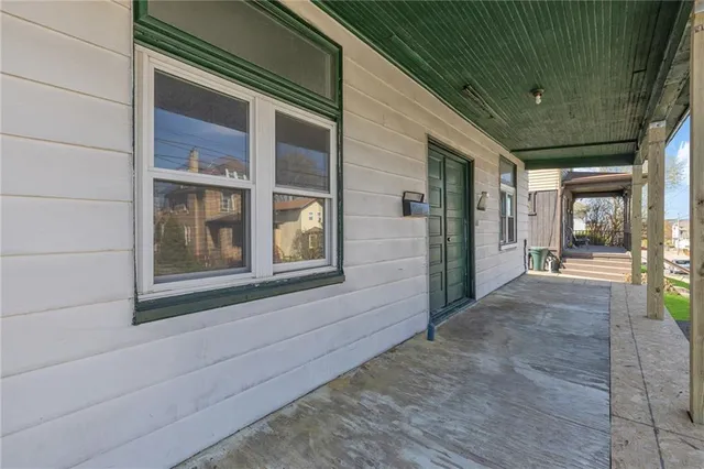 a view of a brick house with a large window