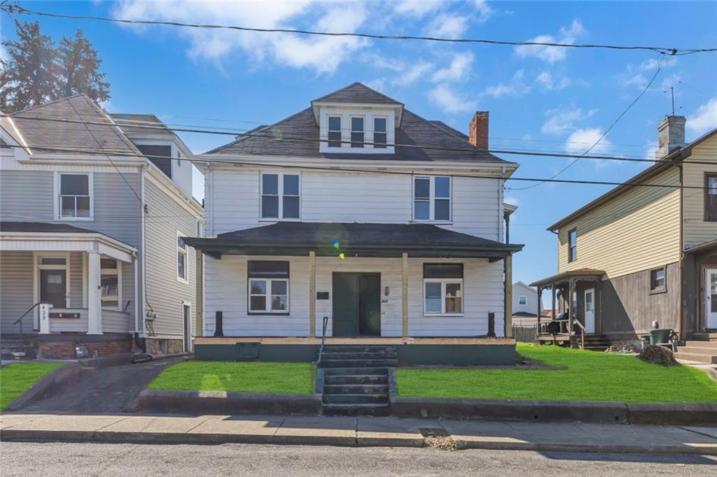 427 Jackson Street Rochester, PA 15074 - Photo 20 of 20 a front view of a house with a garden