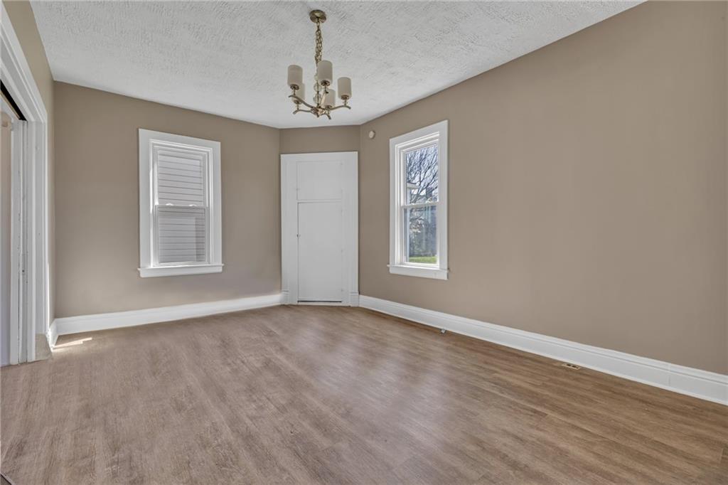 427 Jackson Street Rochester, PA 15074 - Photo 5 of 20 a view of an empty room with a window