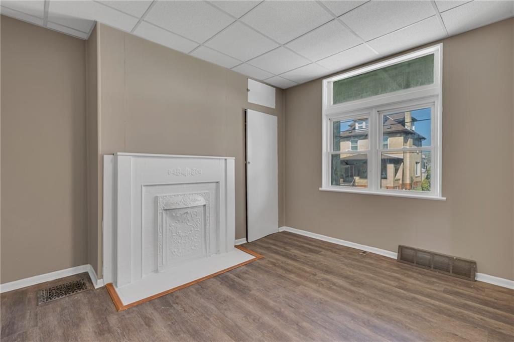427 Jackson Street Rochester, PA 15074 - Photo 10 of 20 a view of empty room with wooden floor and fan