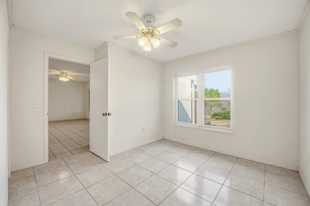 216 Broken Arrow Comanche, TX 76442 - Photo 18 of 38 a view of an empty room with a window