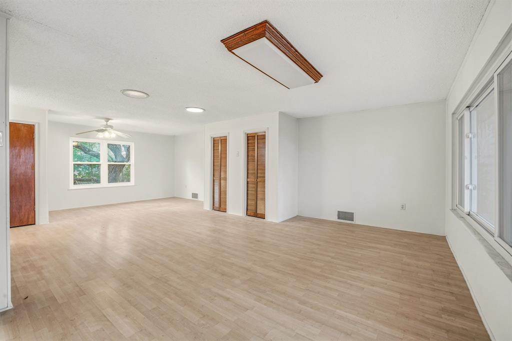 216 Broken Arrow Comanche, TX 76442 - Photo 22 of 38 an empty room with windows and closet