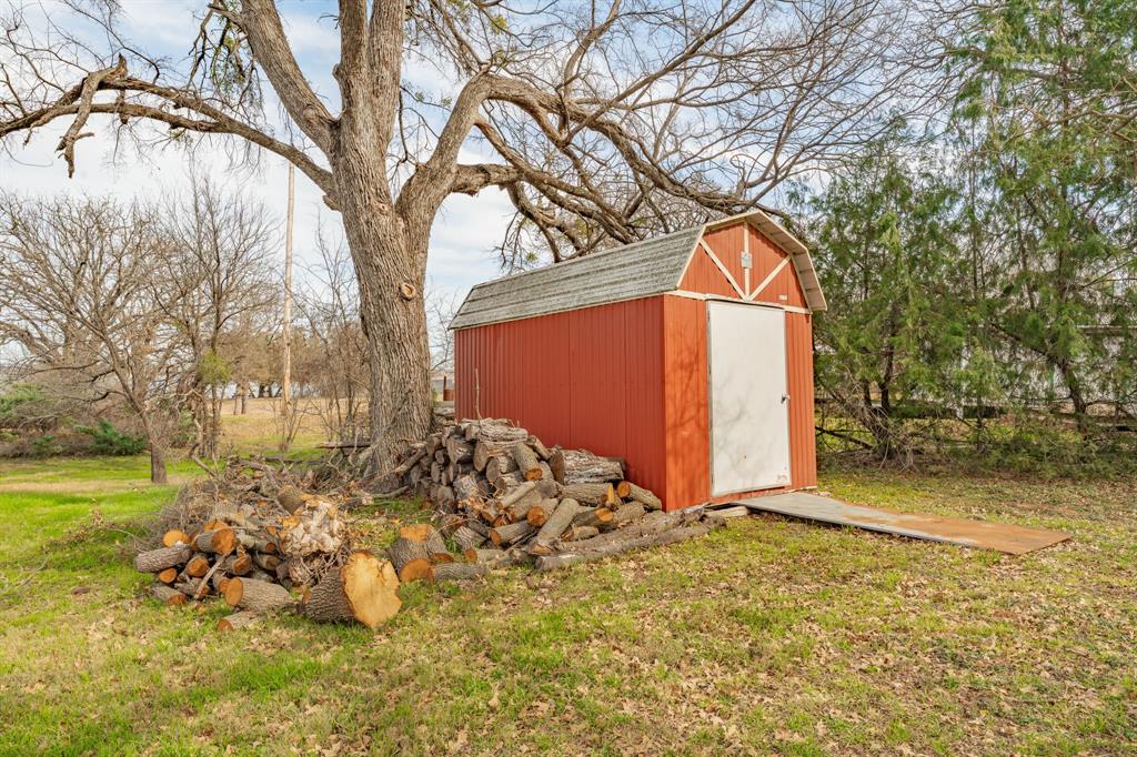 216 Broken Arrow Comanche, TX 76442 - Photo 31 of 38 a view of a backyard of the house
