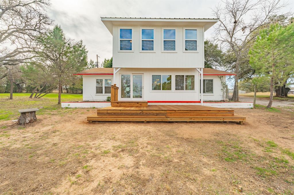 216 Broken Arrow Comanche, TX 76442 - Photo 4 of 38 a view of a house with a yard and sitting area