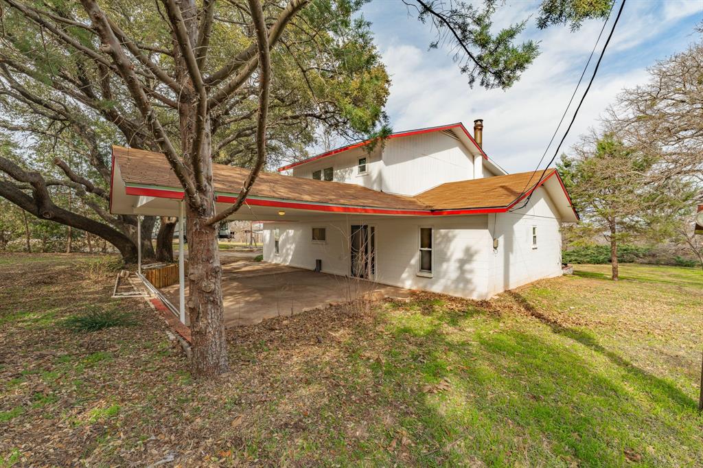 216 Broken Arrow Comanche, TX 76442 - Photo 6 of 38 a view of a house with a yard
