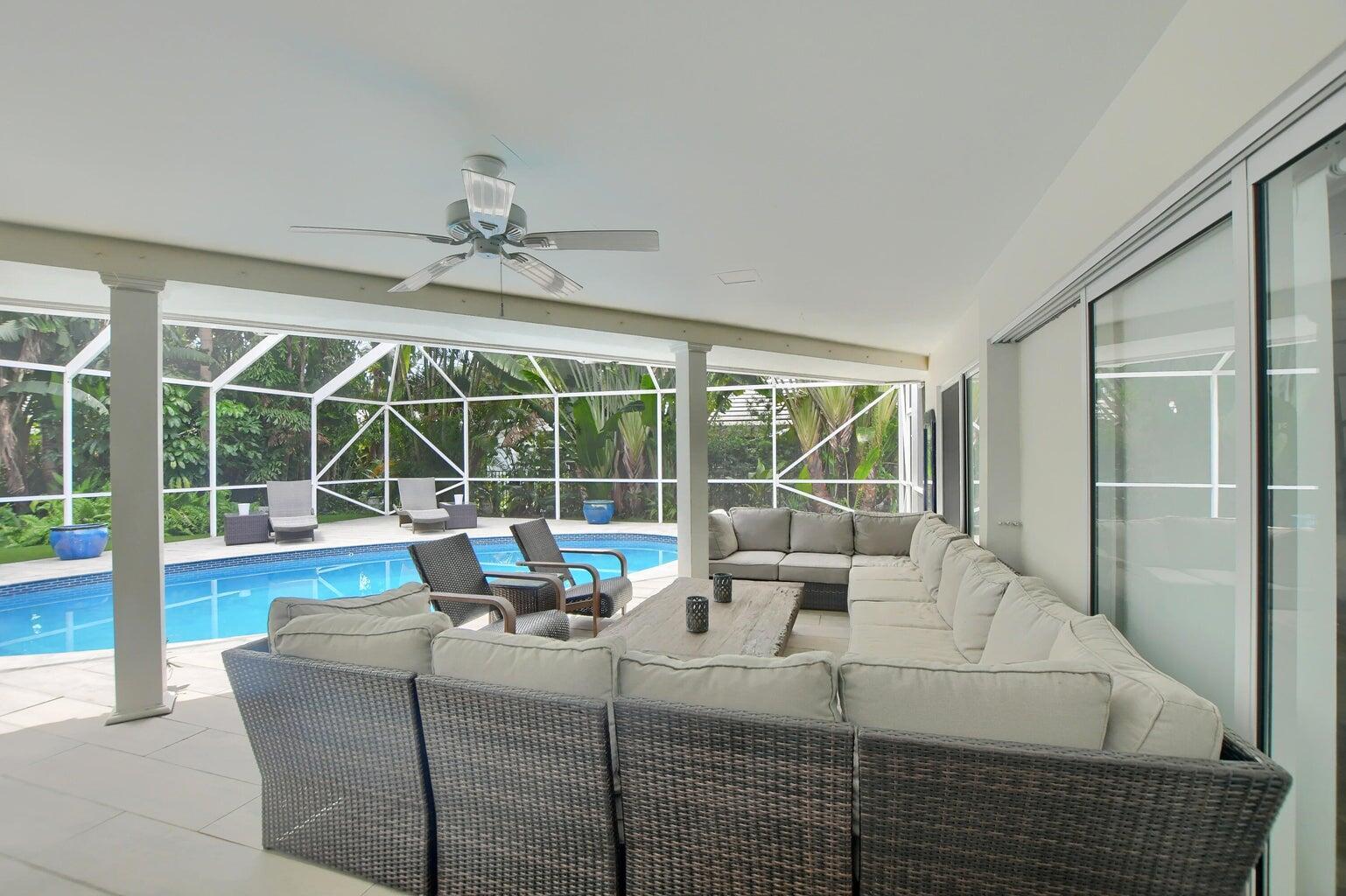 880 Hickory Terrace Boca Raton, FL 33486 - Photo 31 of 38 a living room with couch and a large window