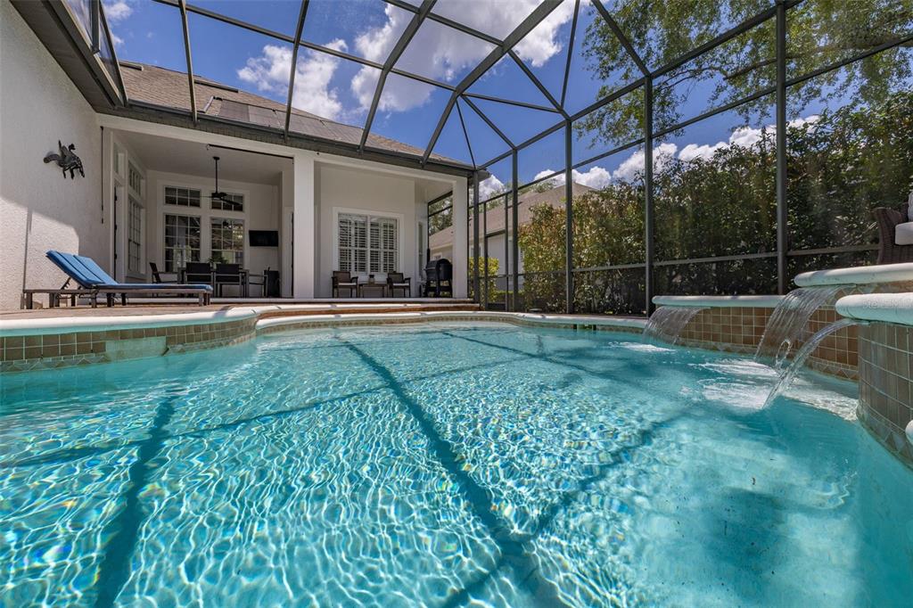8351 Bowden Way Windermere, FL 34786 - Photo 50 of 71 a view of a swimming pool with a patio
