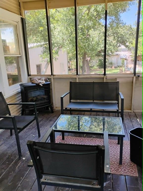 763 Frontier Street Bowie, TX 76230 - Photo 16 of 28 a living room with a large window and a table