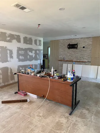 a room with lots of wooden cabinets