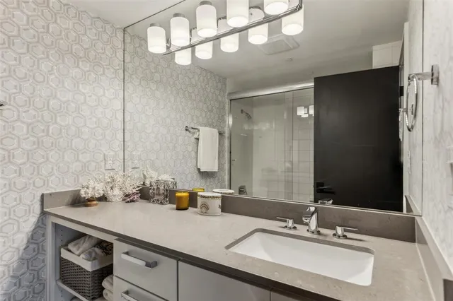 a bathroom with a sink and a mirror