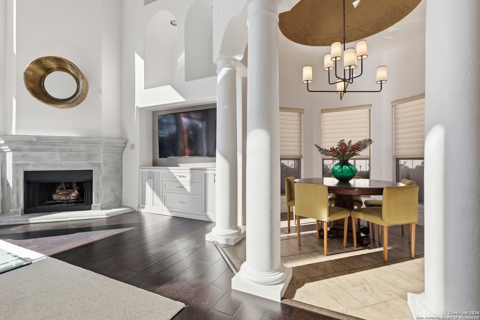 2435 Winding View San Antonio, TX 78260 - Photo 13 of 57 a living room with wooden floor and chandelier
