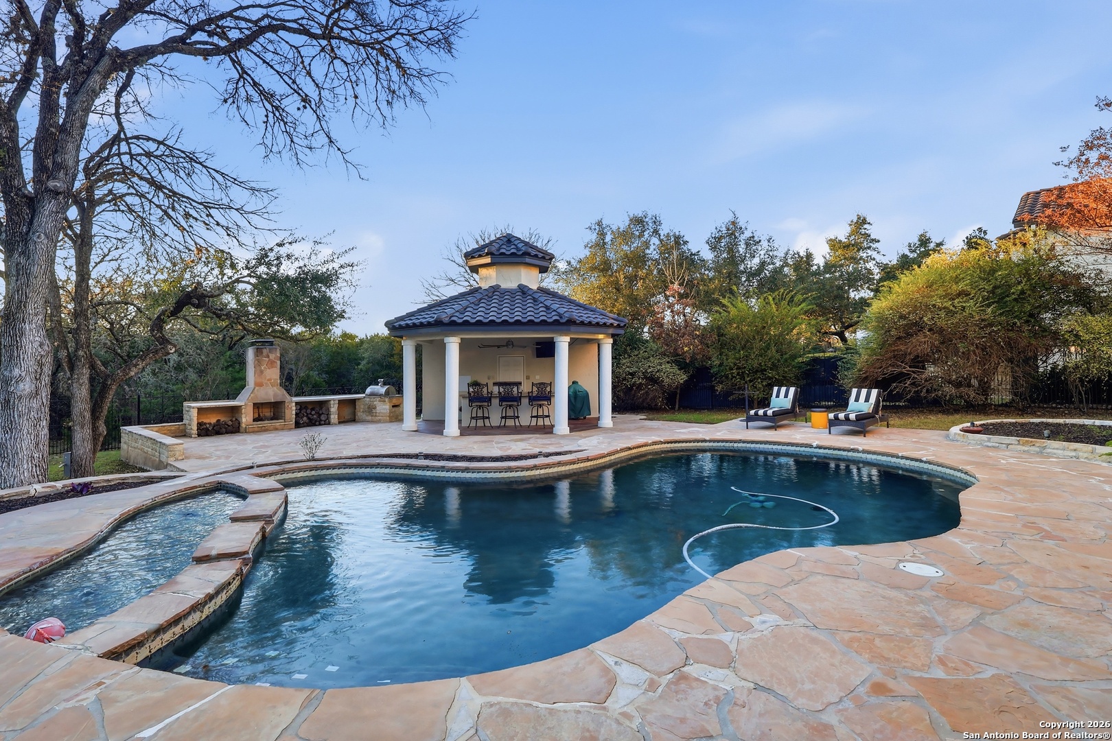 2435 Winding View San Antonio, TX 78260 - Photo 18 of 57 a view of a house with swimming pool and sitting area