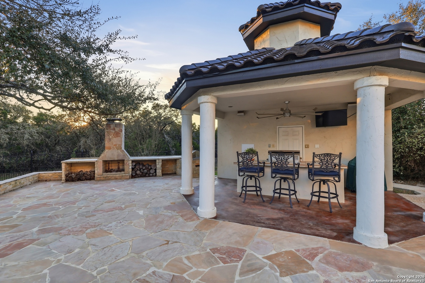2435 Winding View San Antonio, TX 78260 - Photo 19 of 57 a view of a chairs and tables in the back yard of the house