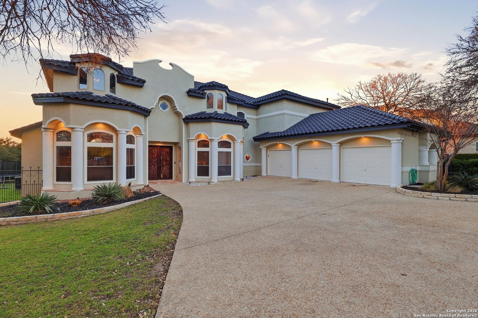 2435 Winding View San Antonio, TX 78260 - Photo 2 of 57 a front view of a house with garden