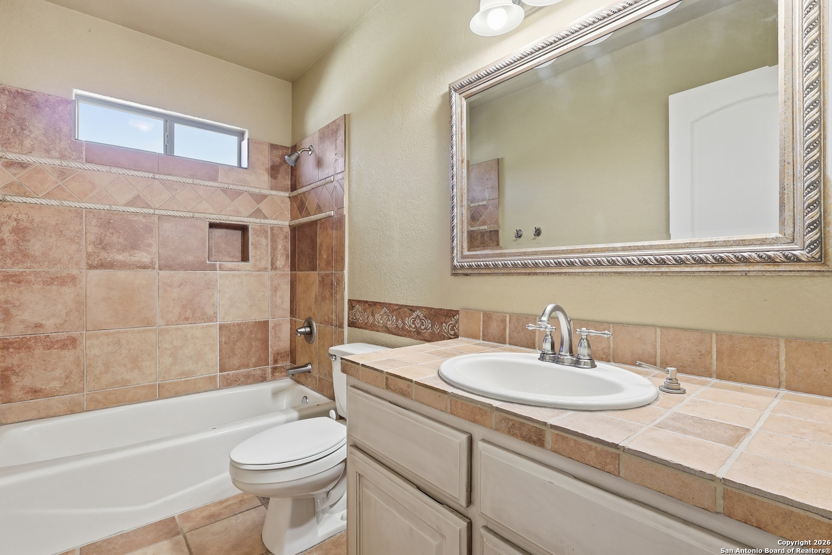 2435 Winding View San Antonio, TX 78260 - Photo 45 of 57 a bathroom with a sink and a mirror