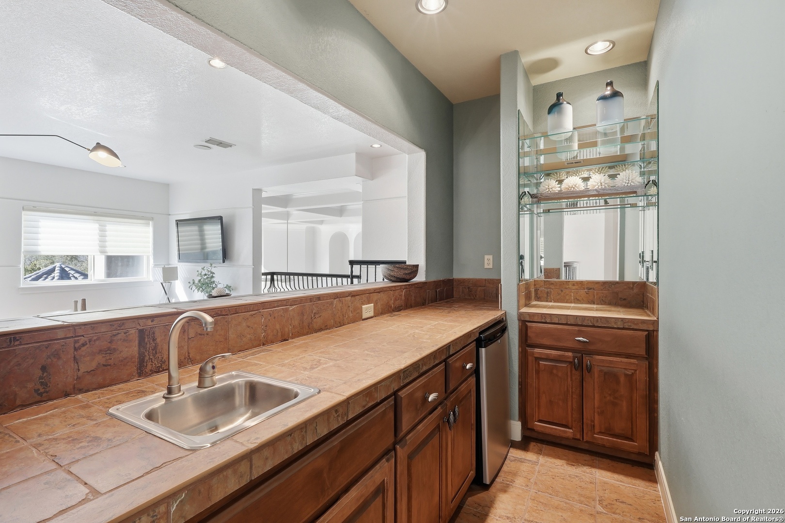 2435 Winding View San Antonio, TX 78260 - Photo 48 of 57 a bathroom with a granite countertop sink and a mirror
