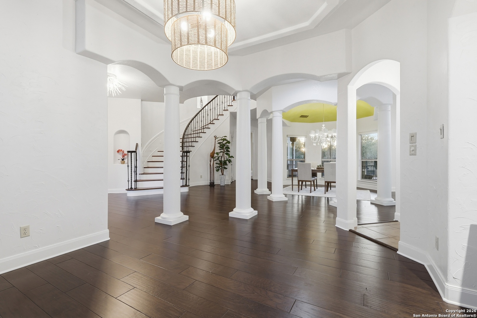 2435 Winding View San Antonio, TX 78260 - Photo 5 of 57 a view of an entryway with wooden floor and a chandelier