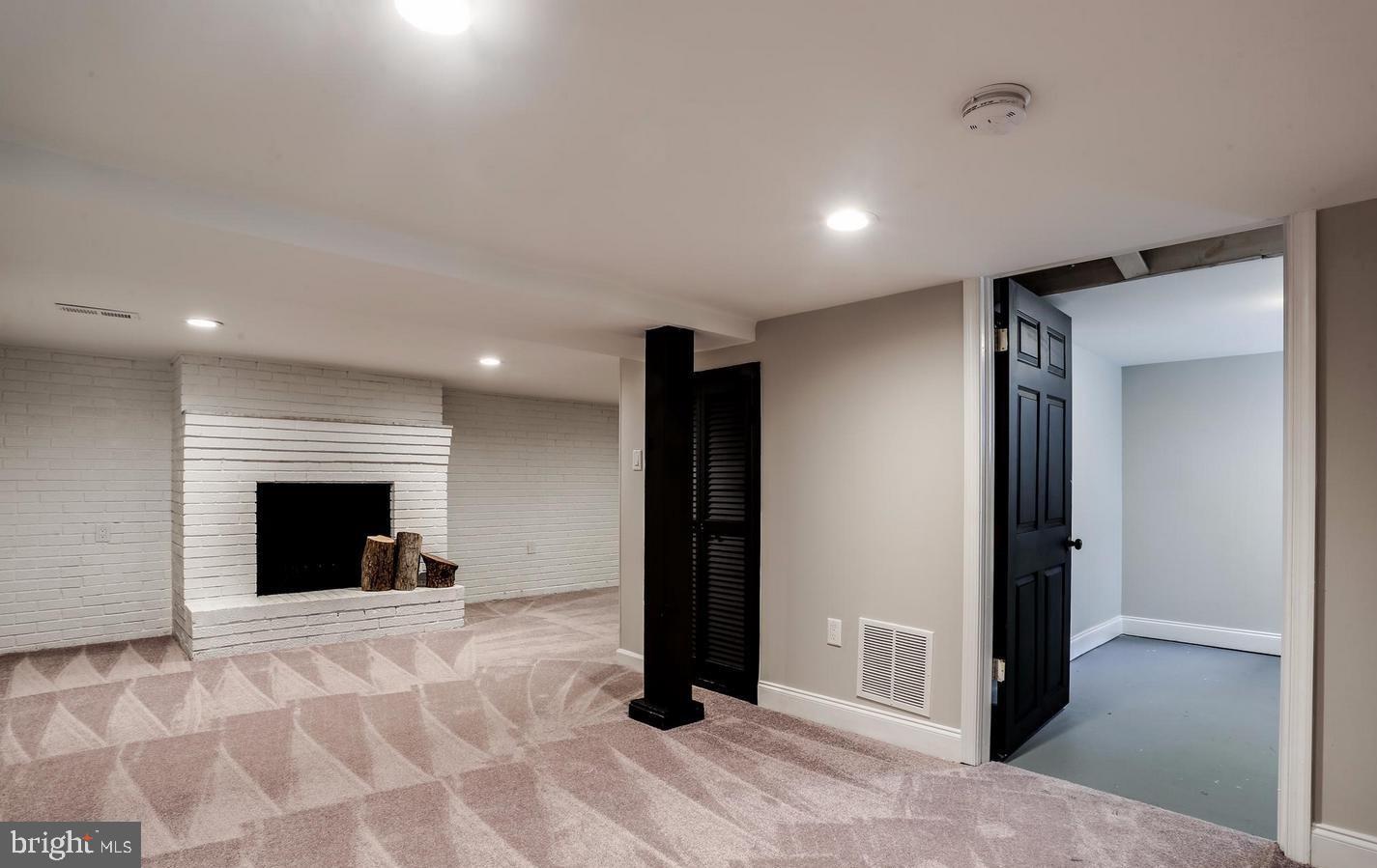 802 Cedarcroft Road Baltimore, MD 21212 - Photo 21 of 38 Basement Family room with wood burning fireplace
