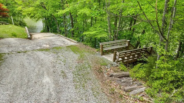 a view of a garden with wooden bench