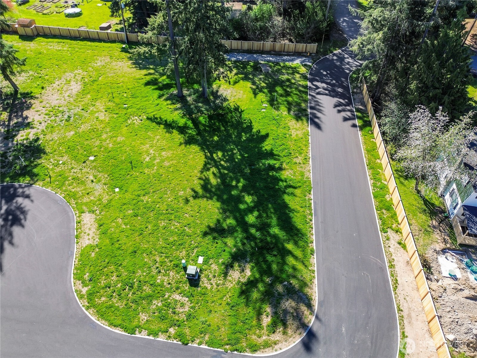 19604 95th Avenue East Graham, WA 98338 - Photo 9 of 12 a view of a garden with a lake