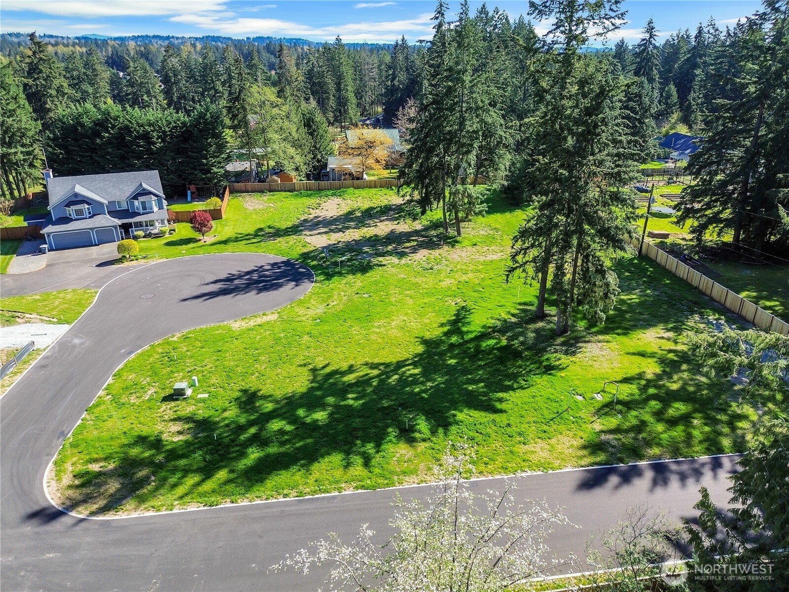 19604 95th Avenue East Graham, WA 98338 - Photo 10 of 12 a view of a backyard with swimming pool