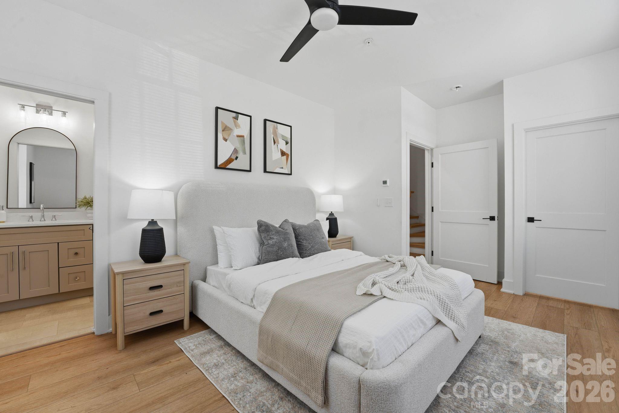 201 Grandin Road, Unit 6 Charlotte, NC 28208 - Photo 12 of 45 a bedroom with a bed and a night stand