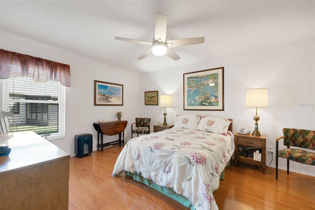 3681 Ridgemont Court Palm Harbor, FL 34684 - Photo 24 of 81 a bedroom with a bed and a table
